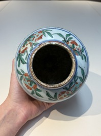 A Chinese wucai &lsquo;Buddhist Lion&rsquo; vase and cover, Transitional period