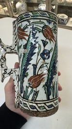 A polychrome Iznik mug, late 16th C.