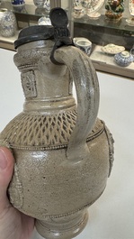 A Siegburg stoneware jug with mounted pewter lid, dated 1594