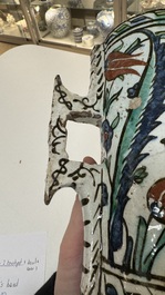 A polychrome Iznik mug, late 16th C.