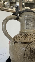 A Siegburg stoneware jug with mounted pewter lid, dated 1594