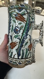 A polychrome Iznik mug, late 16th C.