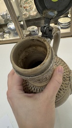 A Siegburg stoneware jug with mounted pewter lid, dated 1594