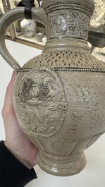 A Siegburg stoneware jug with mounted pewter lid, dated 1594
