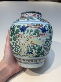 A Chinese wucai &lsquo;Buddhist Lion&rsquo; vase and cover, Transitional period