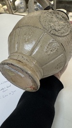 A Siegburg stoneware jug with mounted pewter lid, dated 1594