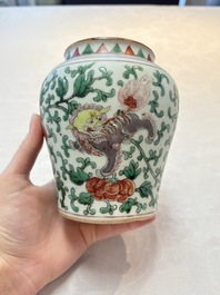 A small Chinese wucai 'Buddhist Lions and Peony Scrolls' jar, Transitional period