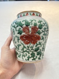 A small Chinese wucai 'Buddhist Lions and Peony Scrolls' jar, Transitional period