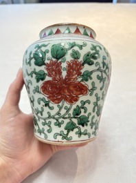 A small Chinese wucai 'Buddhist Lions and Peony Scrolls' jar, Transitional period