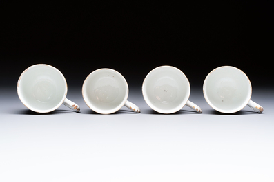 Four sets of Chinese export grisaille and gilt-decorated handled cups and saucers with crowned monograms, Qianlong