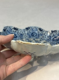 A fine blue and white Dutch Delft strawberry strainer and stand, 18th C.