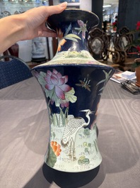 A Chinese famille rose blue-ground 'Lotus Pond' vase, Daoguang mark, 20th C.