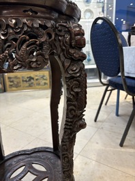 Two finely carved Chinese marble-topped hongmu stands, 19th C.