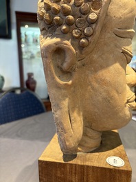 A Thai pottery Haripunjaya-style head of Buddha, possibly 13th C.
