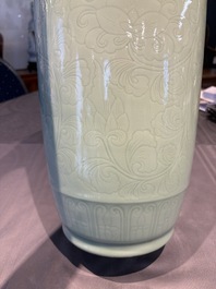A Chinese celadon-glazed rouleau vase with incised floral design, 18th C.