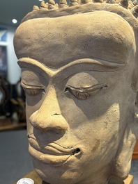 A Thai pottery Haripunjaya-style head of Buddha, possibly 13th C.