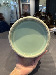 A Chinese celadon-glazed rouleau vase with incised floral design, 18th C.