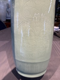A Chinese celadon-glazed rouleau vase with incised floral design, 18th C.