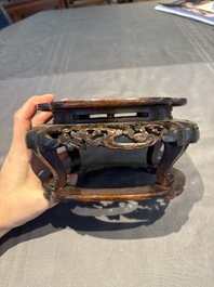 A collection of 38 Chinese wooden stands and a box, 19/20th C.