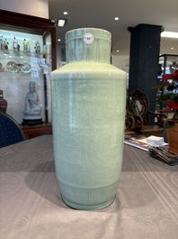 A Chinese celadon-glazed rouleau vase with incised floral design, 18th C.