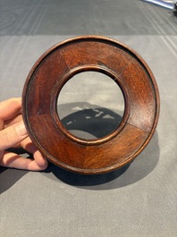 A collection of 38 Chinese wooden stands and a box, 19/20th C.