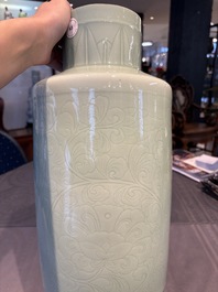 A Chinese celadon-glazed rouleau vase with incised floral design, 18th C.