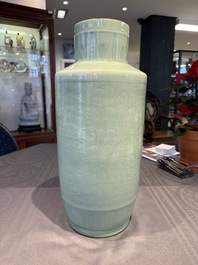 A Chinese celadon-glazed rouleau vase with incised floral design, 18th C.
