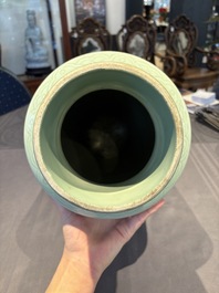 A Chinese celadon-glazed rouleau vase with incised floral design, 18th C.