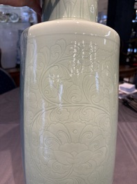 A Chinese celadon-glazed rouleau vase with incised floral design, 18th C.