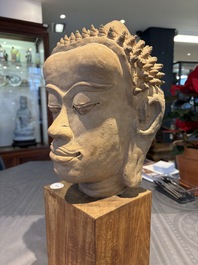 A Thai pottery Haripunjaya-style head of Buddha, possibly 13th C.