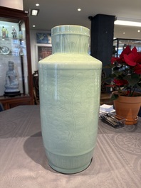 A Chinese celadon-glazed rouleau vase with incised floral design, 18th C.