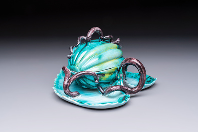 A very rare Brussels faience melon-shaped tureen and cover on stand, 18th C.