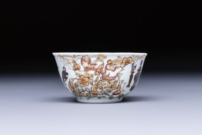 A Chinese gilt-decorated black-enamelled 'Antiquities' cup, Yongzheng/Qianlong