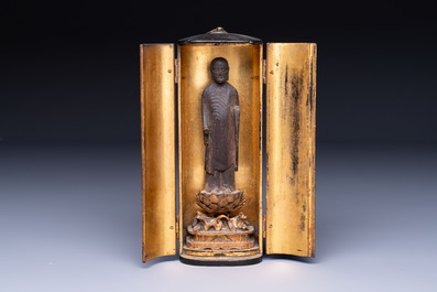 A small Japanese gilt-lacquered wooden zushi shrine with a carved wooden monk, probably Edo, 18/19th C.