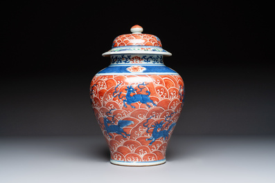 A Chinese blue, white and iron-red decorated 'Mythical Animals' vase and cover, 19th C.