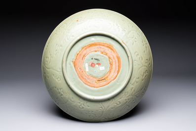 A rare and large Chinese Longquan celadon dish with floral design, Ming, early 15th C.