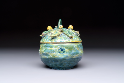 A polychrome Dutch Delft melon-shaped tureen and cover on leaf-shaped stand, 18th C.