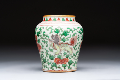 A small Chinese wucai 'Buddhist Lions and Peony Scrolls' jar, Transitional period