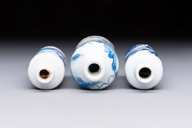 Three Chinese blue, white and copper-red snuff bottles with narrative design, 19th C.