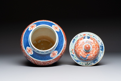 A Chinese blue, white and iron-red decorated 'Mythical Animals' vase and cover, 19th C.