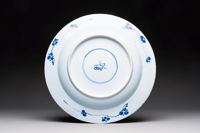 A large Chinese blue and white armorial dish with the arms of Pelgrom for the Dutch market, Kangxi