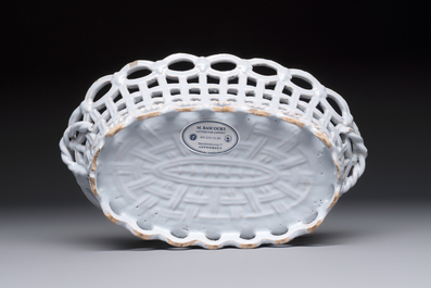 A rare white-glazed Brussels faience reticulated basket on stand, 18th C.