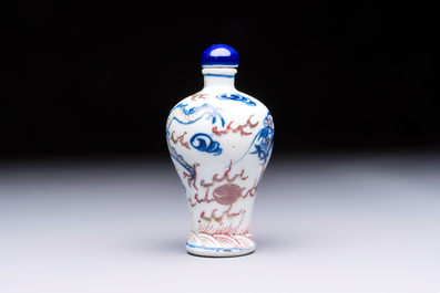 A Chinese blue, white and copper-red 'Dragon' snuff bottle, 19th C.