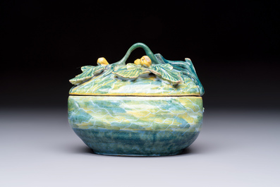 A polychrome Dutch Delft melon-shaped tureen and cover on leaf-shaped stand, 18th C.