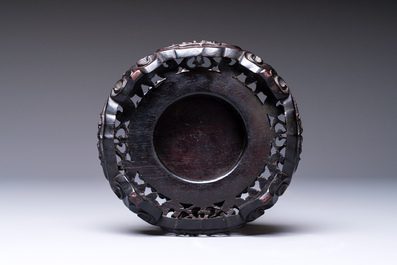 A fine Chinese silver bowl with relief dragon design on reticulated wooden stand, Tai Chang Long 泰昌隆 mark, 19th C.