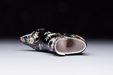 An extremely rare black Delftware model of a shoe, early 18th C.
