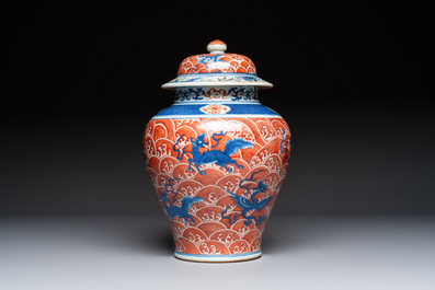 A Chinese blue, white and iron-red decorated 'Mythical Animals' vase and cover, 19th C.