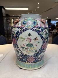 A large Chinese famille rose vase with lion-form handles and cover, 19th C.