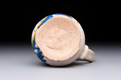A very rare polychrome Antwerp maiolica 'IHS' jug, 16th C.