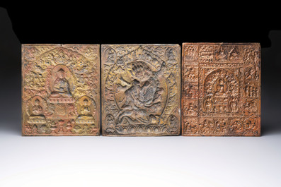 Three Tibetan copper repouss&eacute; plaques with Buddhist subjects, 19th C.
